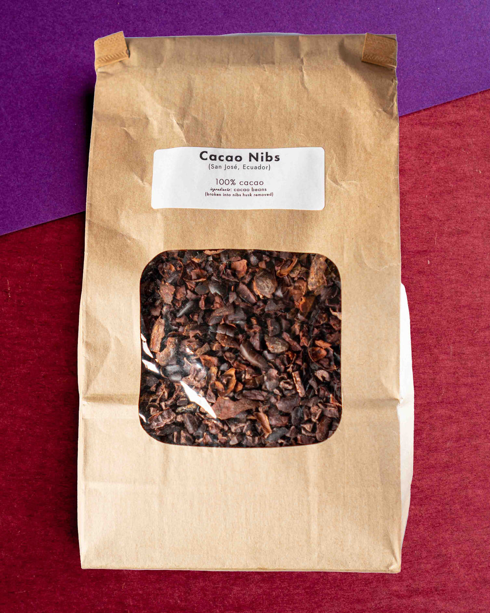 Cacao nibs in a kraft bag, labeled San José, Ecuador