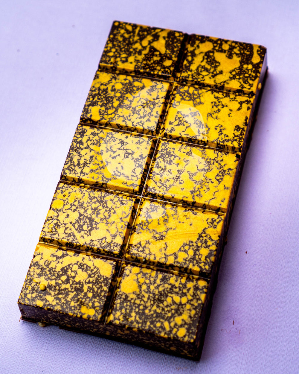 Gianduja Roche STUFFT bar at an angle, showing its thickness